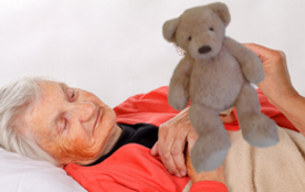 older woman with bear